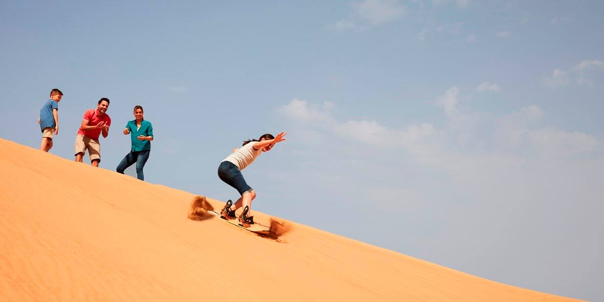 Sand boarding at Dubai desert dunes