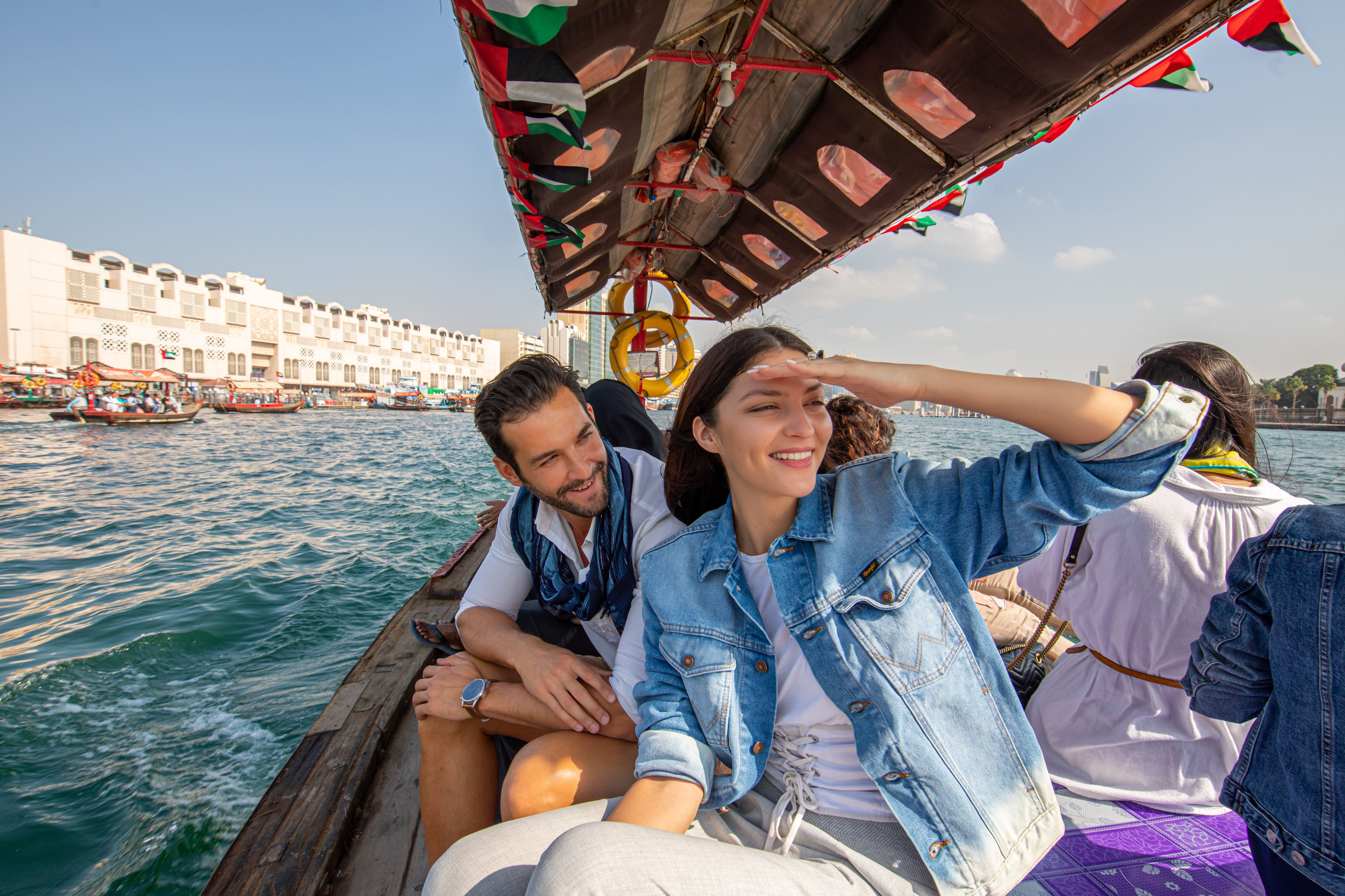 Couple crossing Dubai Creek on an Abra