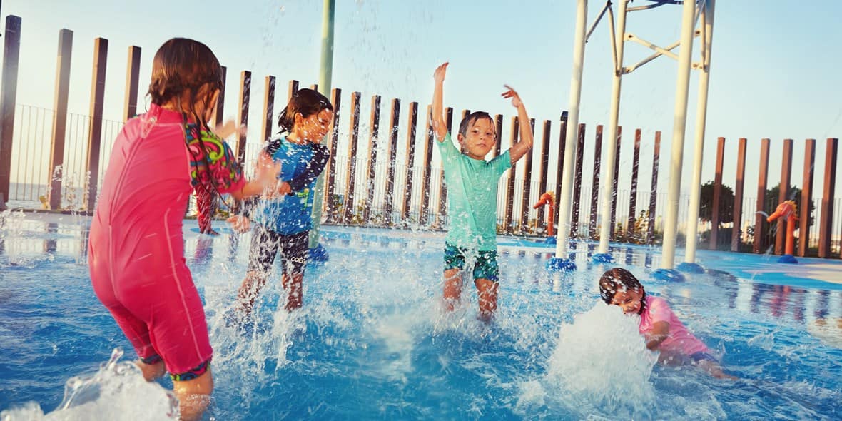 Kids splashing water at The Beach water park in Dubai