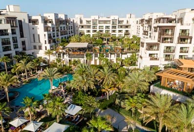 Aerial view of Jumeirah Al Naseem with lush gardens and swimming pools