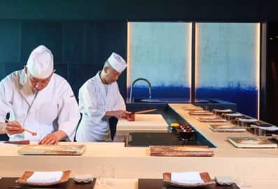 Sushi chefs preparing a traditional Omakase course at Hōseki Dubai