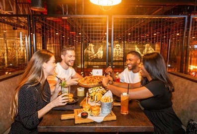 group of friends dining at Brass Monkey