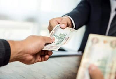 2 hands holding money