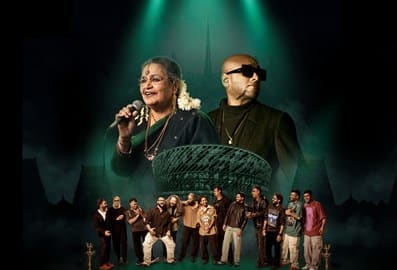 Musicians performing on stage with a group of performers