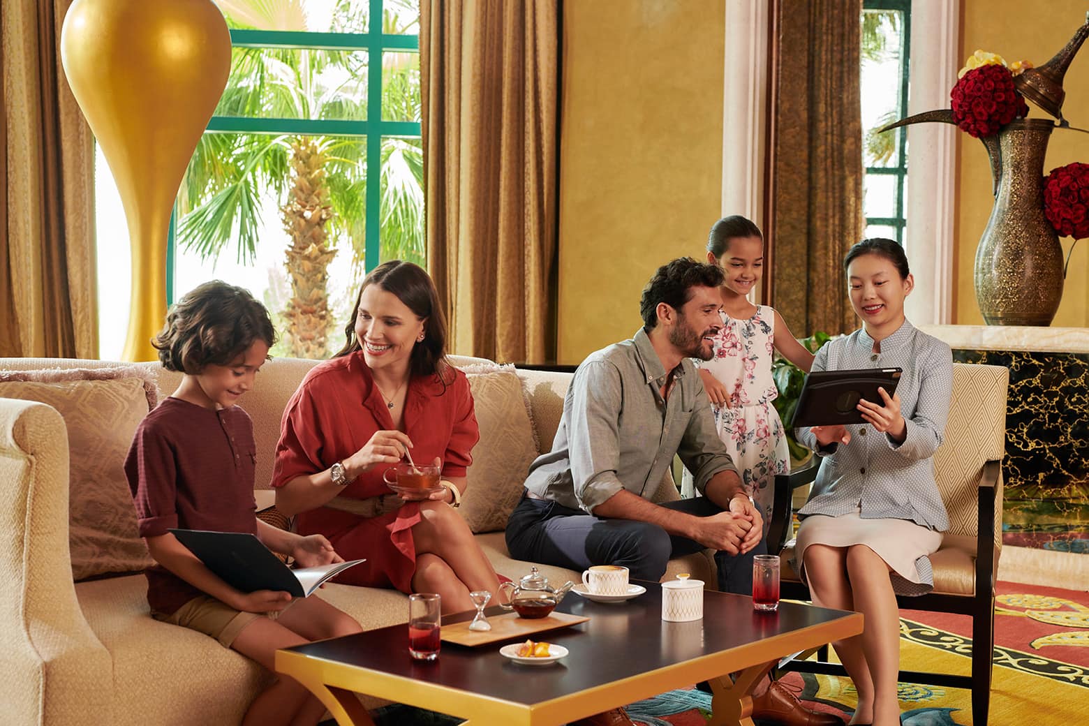 family having tea atlantis the royal