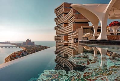 Luxury resort terrace with an infinity pool overlooking Dubai's coastline