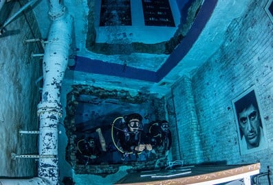 Diver exploring the underwater environment at Deep Dive Dubai
