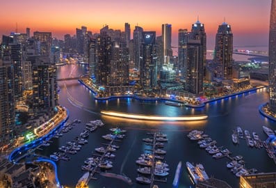 Aerial view of Dubai Marina with yachts and waterfront towers
