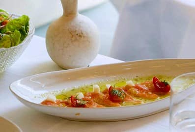 Signature Greek seafood carpaccio and fresh salad at GAIA restaurant