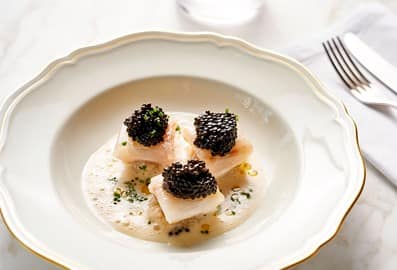 Signature gourmet dish with caviar at Il Ristorante - Niko Romito