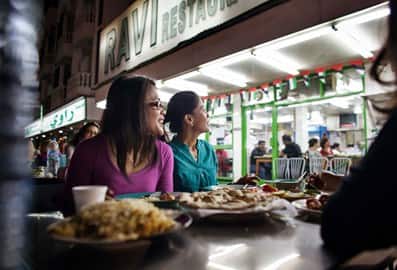 Friends dining outside the iconic Ravi Restaurant in Satwa, Dubai