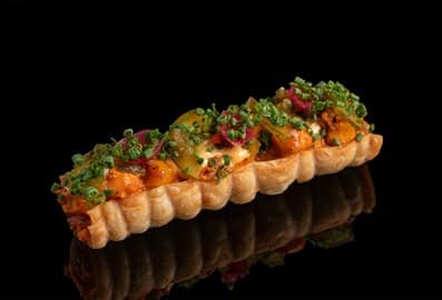 Bite-sized modern Indian street food appetizer at Revelry