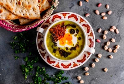 Traditional Persian soup and flatbread at Shabestan restaurant in Dubai