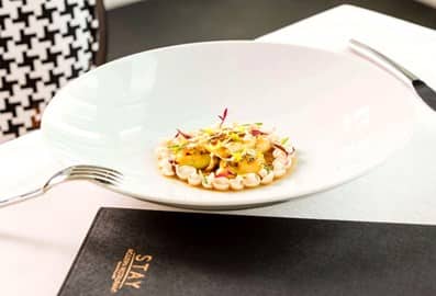 Fine dining dish presentation and table setting at STAY by Yannick Alléno