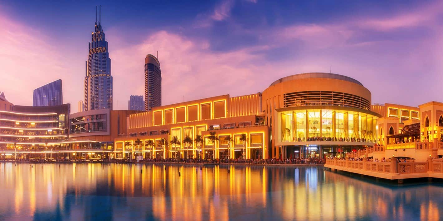 Panoramic view of the Dubai Mall at sunset.