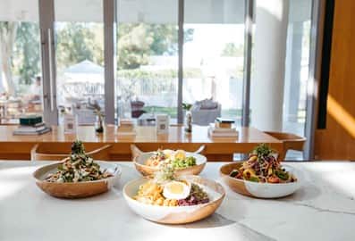 Four dishes of salad at The Hundred Wellness Centre Cafe