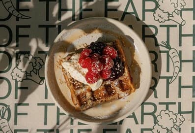 Signature French toast and fresh berries at Of The Earth café