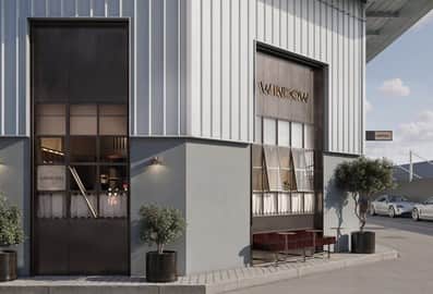 The industrial warehouse facade and entrance of Window restaurant at Alserkal Avenue