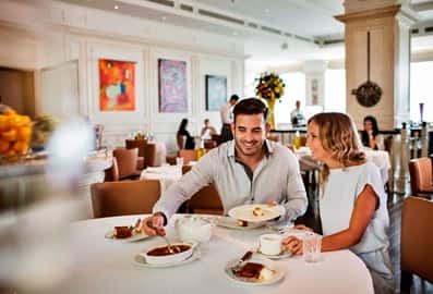 Couple enjoying food at #ThreeChefsDinner