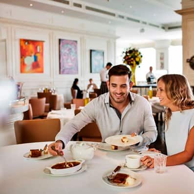 Couple enjoying food at #ThreeChefsDinner