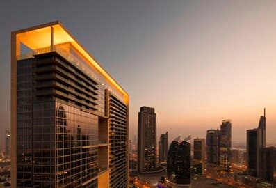 Waldorf Astoria Dubai International Financial Centre overlooking the city skyline at sunset