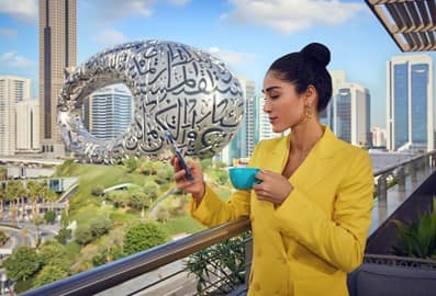 25 Hour Hotel outdoor view of Museum of the future | Female using the mobile