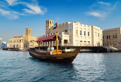 An elderly couple enjoying a boat trip on the Dubai Creek.