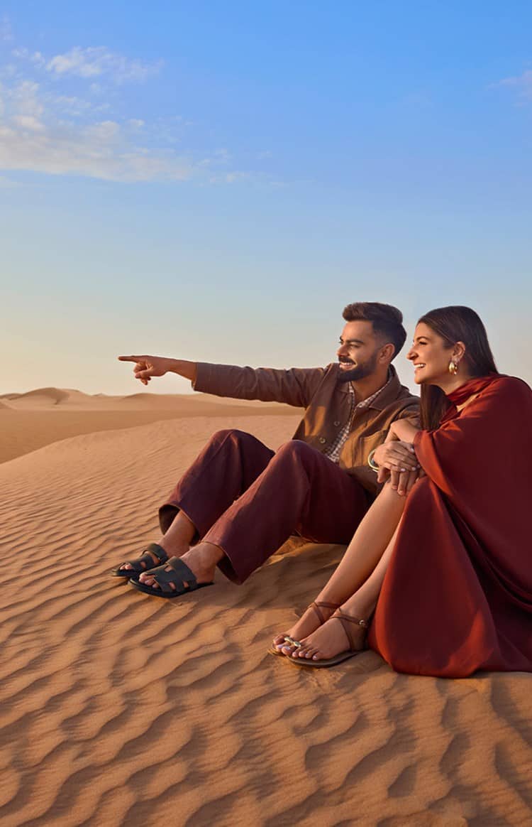 Virat Kohli and Anushka Sharma admiring the dunes in the Dubai desert
