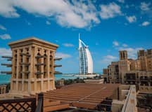 Aerial view of Madinat Jumeirah with Burj Al Arab in the background.