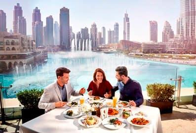 Group dining at a restaurant in downtown Dubai near the Dubai Fountain.