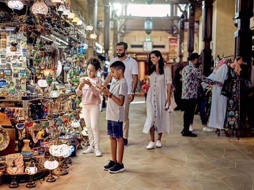 Family at Souk Madinat in Jumeirah shopping for mementos