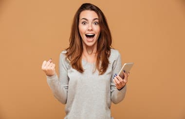 Excited woman by phone message