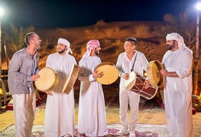 Emirati dancers with visitors